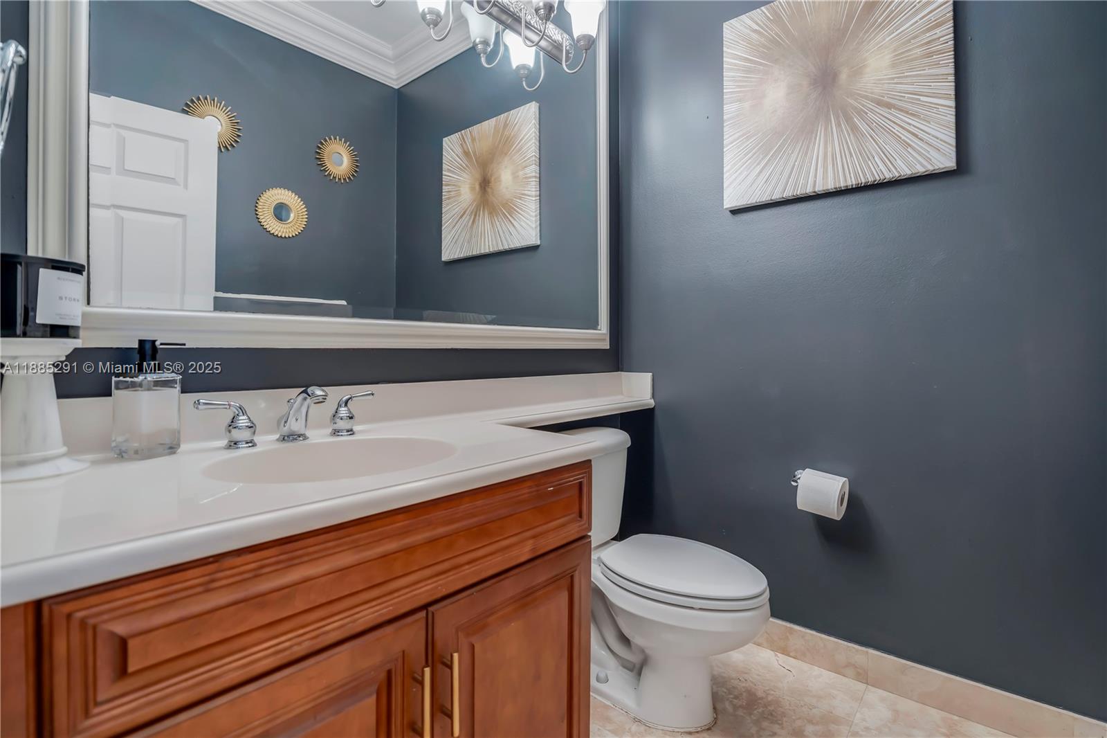 4166 Southwest 190th Avenue Miramar, FL 33029 - Photo 18 of 70 a bathroom with a toilet a sink and mirror