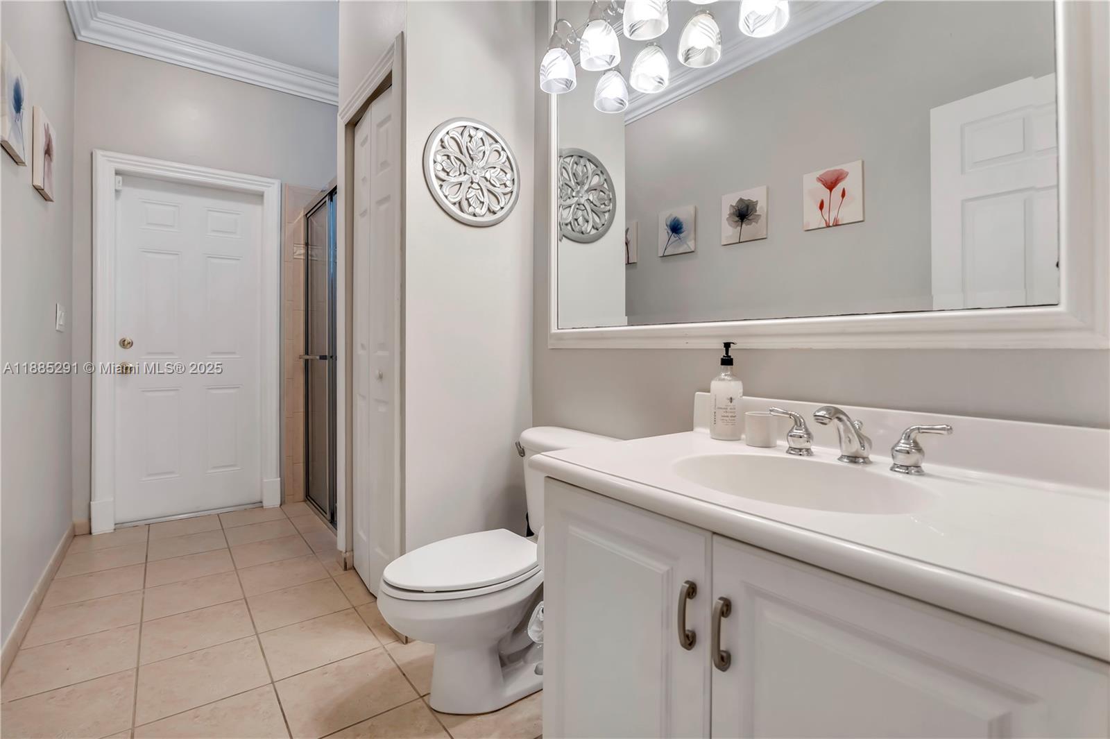 4166 Southwest 190th Avenue Miramar, FL 33029 - Photo 20 of 70 a spacious bathroom with a sink a toilet and a mirror