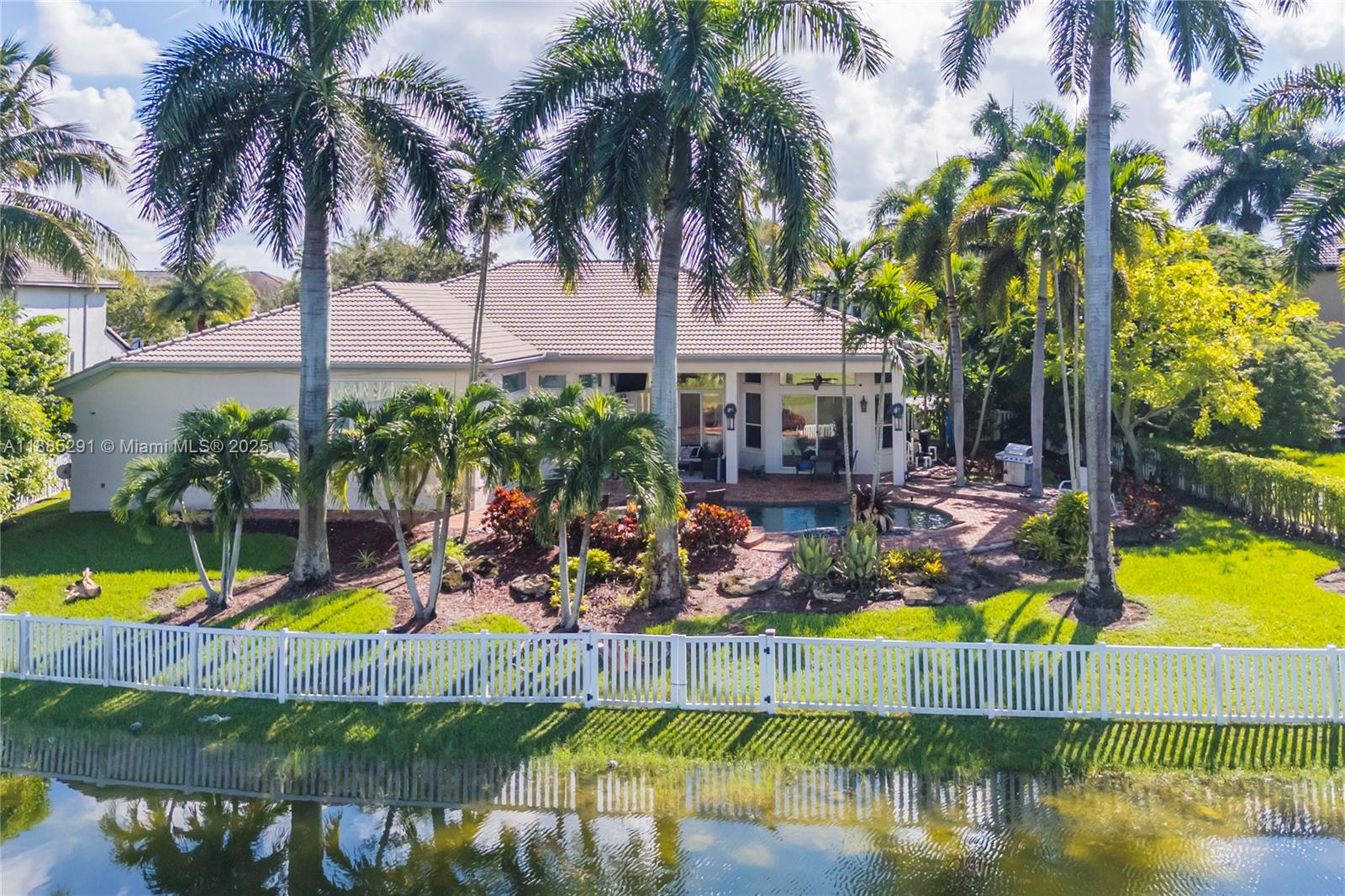 4166 Southwest 190th Avenue Miramar, FL 33029 - Photo 2 of 70 a view of swimming pool with palm trees