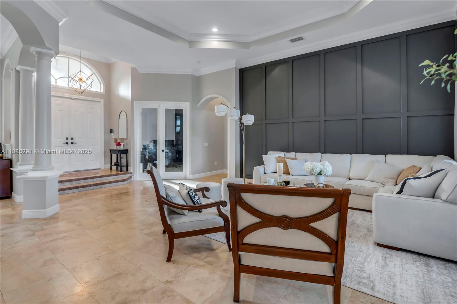 4166 Southwest 190th Avenue Miramar, FL 33029 - Photo 22 of 70 a living room with furniture and a chandelier