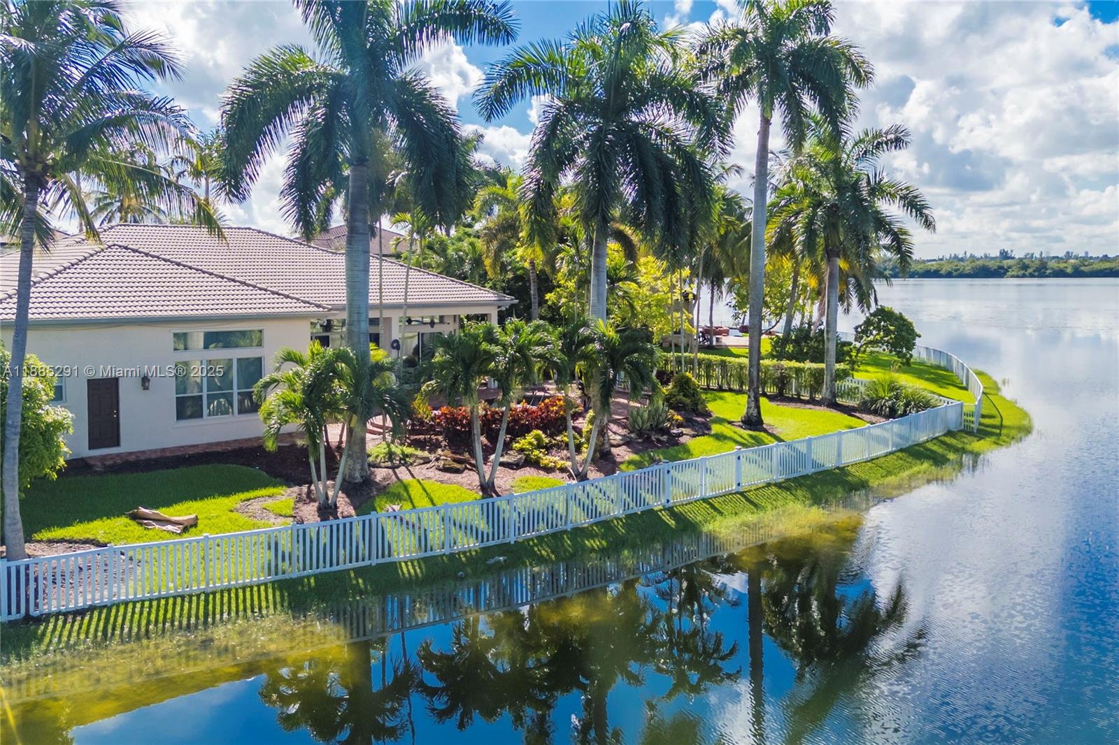 4166 Southwest 190th Avenue Miramar, FL 33029 - Photo 3 of 70 a view of swimming pool with a garden and plants
