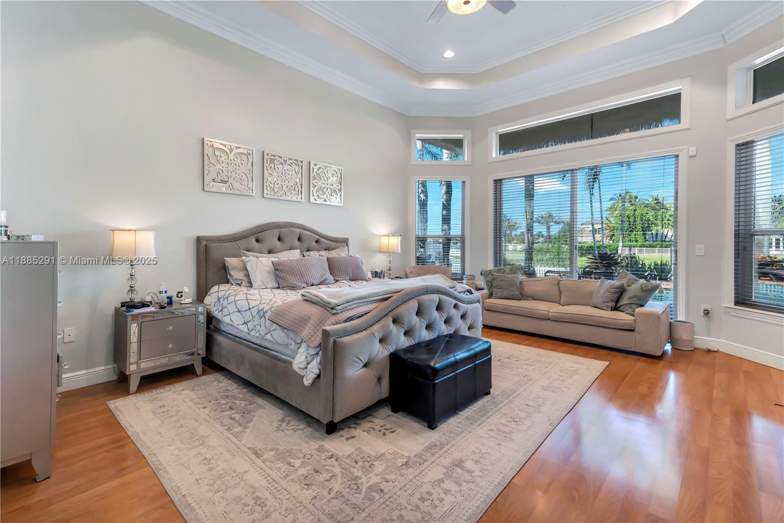 4166 Southwest 190th Avenue Miramar, FL 33029 - Photo 31 of 70 a spacious bedroom with a bed couch and a large window