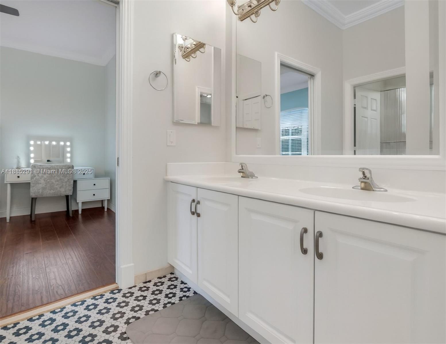 4166 Southwest 190th Avenue Miramar, FL 33029 - Photo 38 of 70 a en suite bathroom with a sink double vanity and a mirror