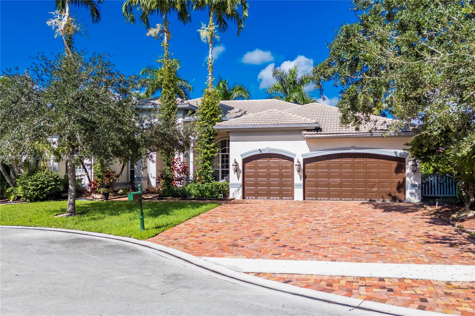4166 Southwest 190th Avenue Miramar, FL 33029 - Photo 51 of 70 a front view of a house with yard and trees
