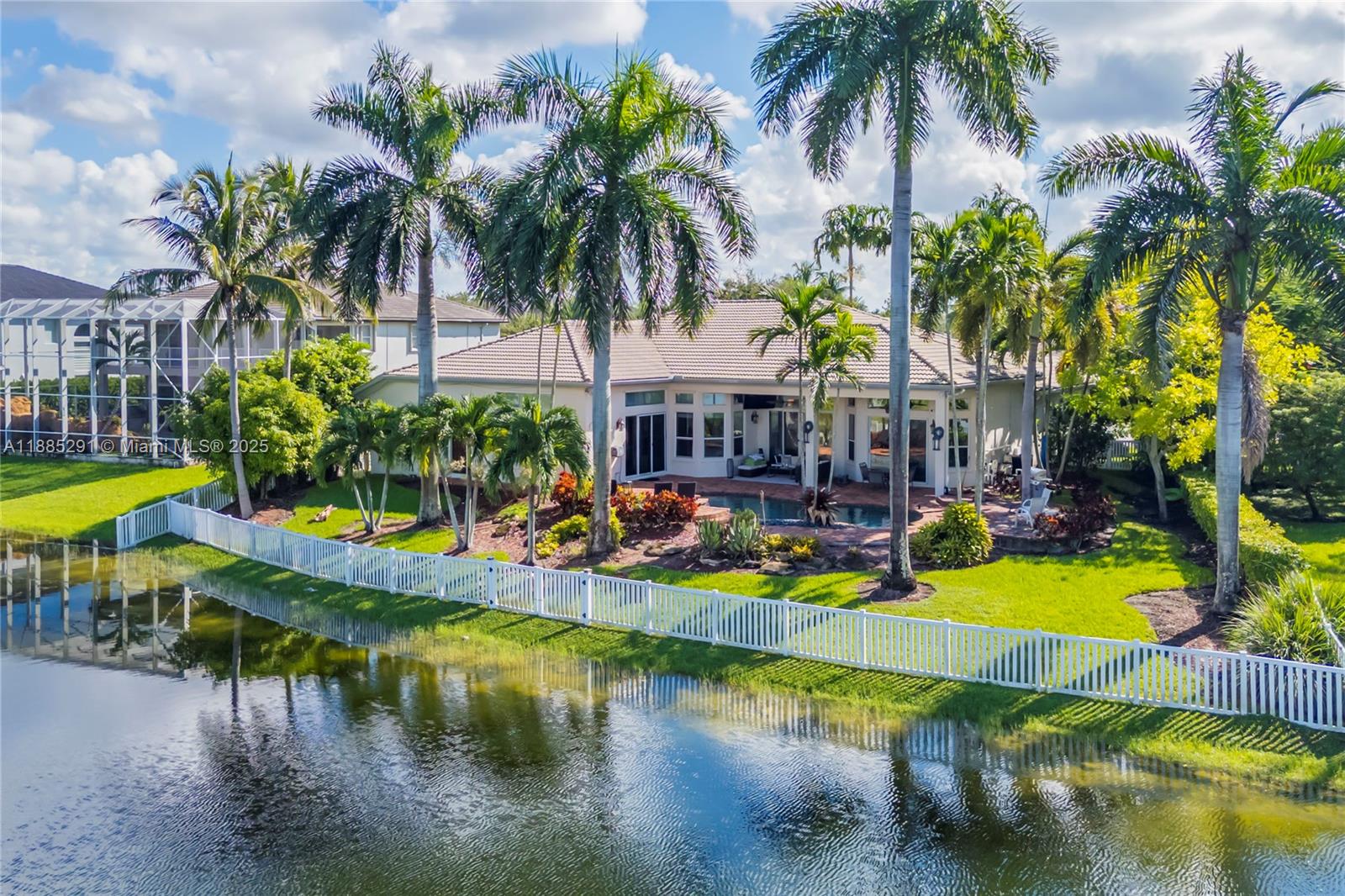 4166 Southwest 190th Avenue Miramar, FL 33029 - Photo 65 of 70 a view of swimming pool with outdoor seating and a water fall