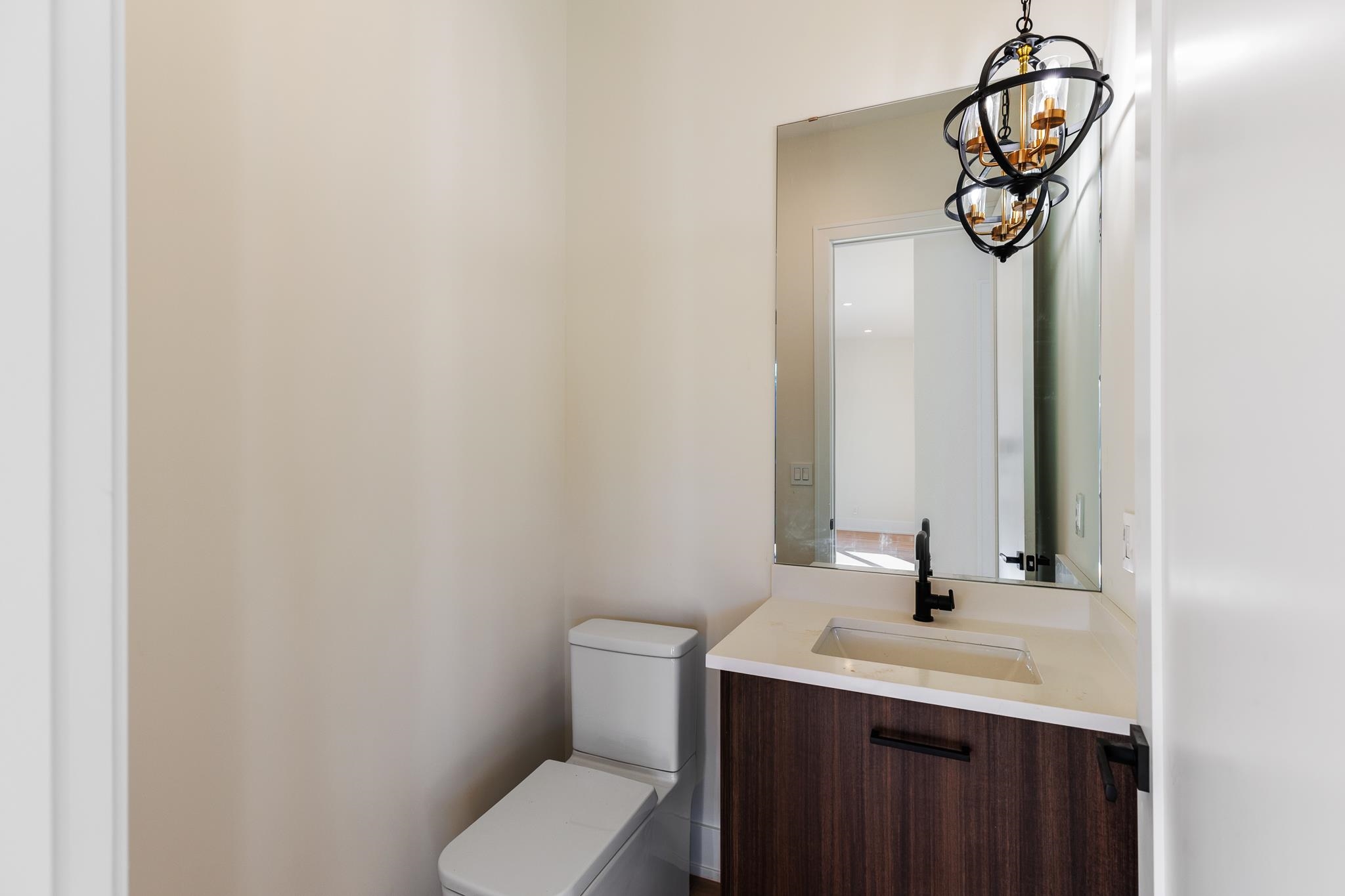 6425 Ranch Road 962 West Round Mountain, TX 78663 - Photo 24 of 30 a bathroom with a toilet a sink and mirror