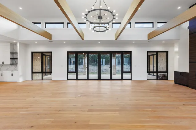 a large hall with stainless steel appliances kitchen island granite countertop furniture