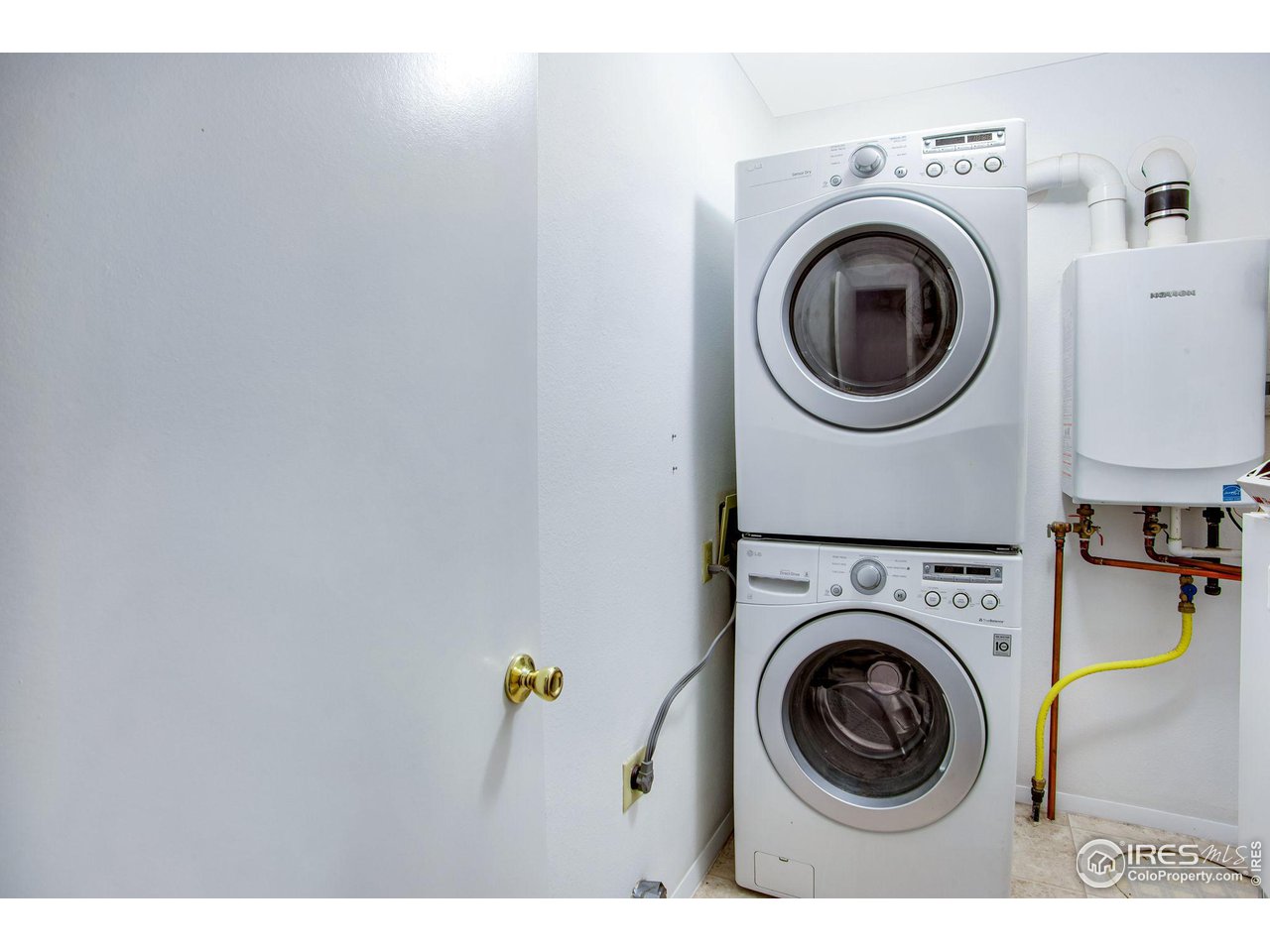60 Lodgepole Drive Windsor, CO 80550 - Photo 21 of 27 a view of washer and dryer in a utility room