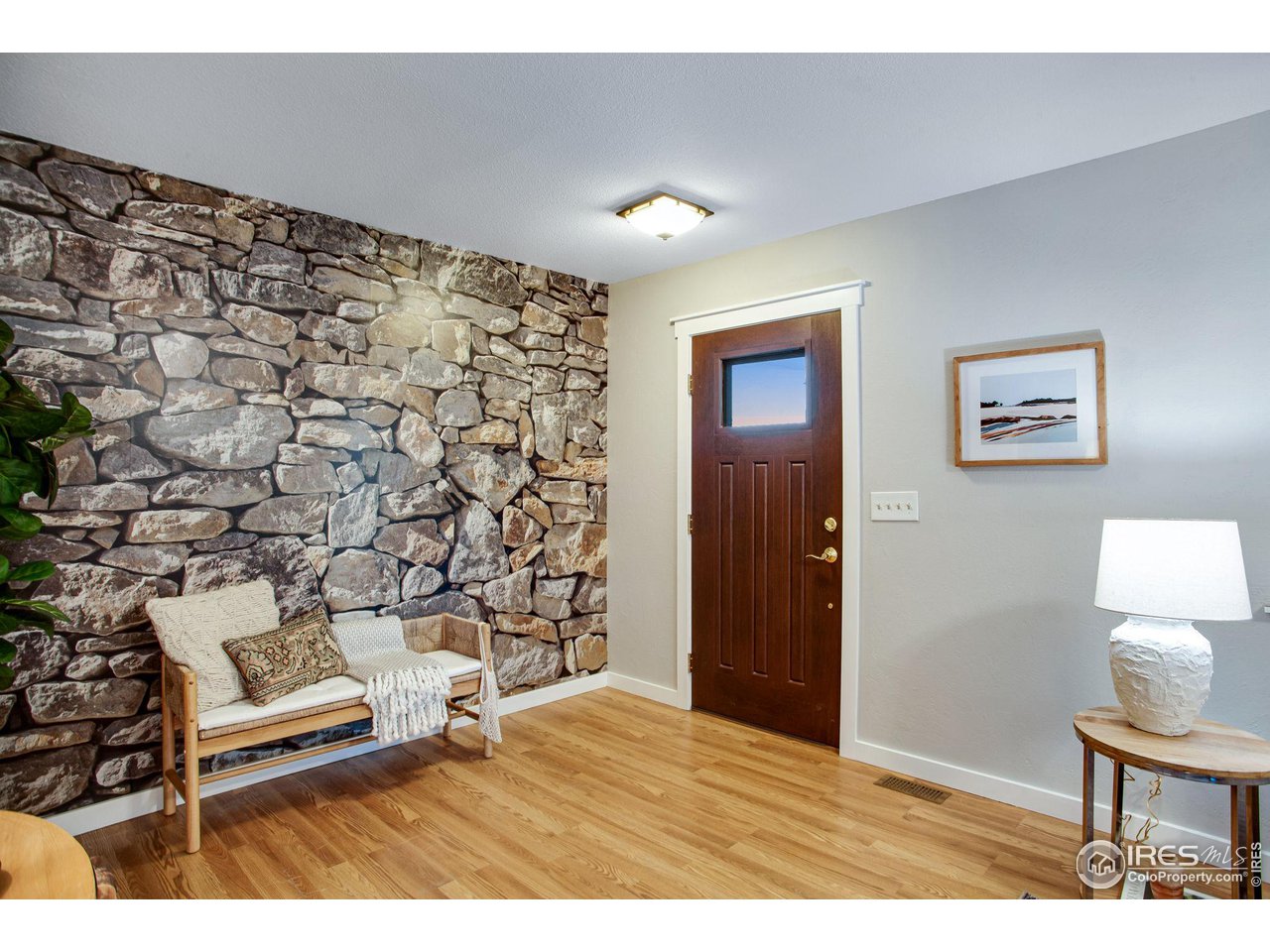 60 Lodgepole Drive Windsor, CO 80550 - Photo 4 of 27 a view of an empty room and wooden floor