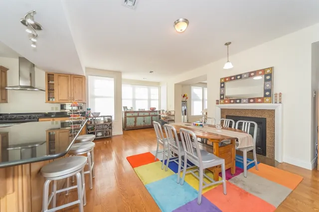 a view of a dining room with furniture and a rug