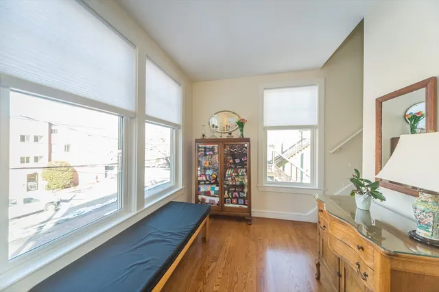 a bedroom with furniture and a flat screen tv