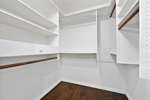 a view of an empty walk in closet
