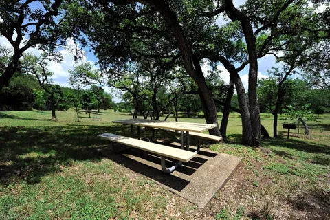 a view of a backyard with a sitting area