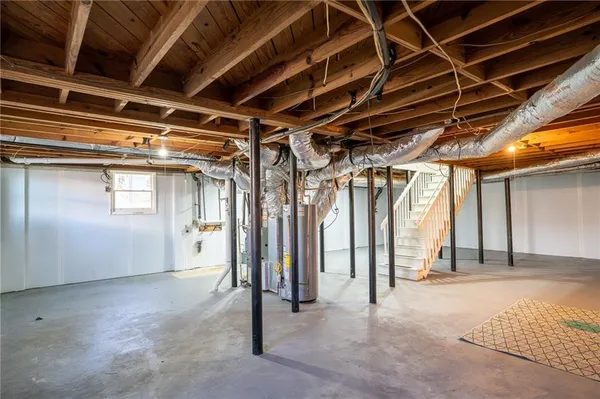 a view of empty room with wooden walls
