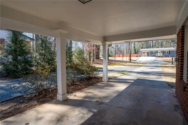a view of a porch and garden