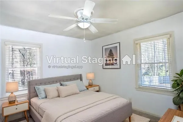 a bedroom with a large bed and a window