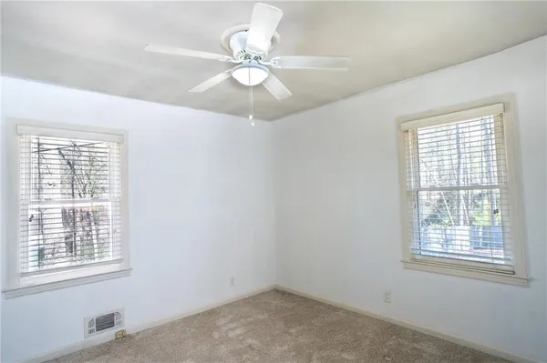 a view of an empty room with a window