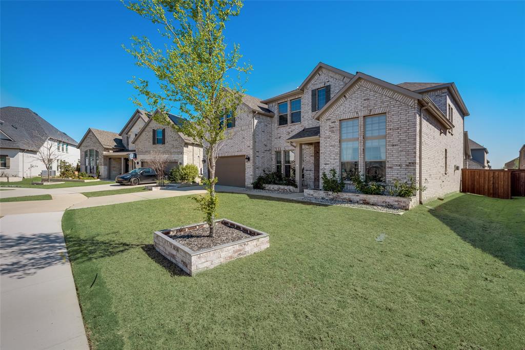 16476 Ryder Rock Road Frisco, TX 75033 - Photo 3 of 40 Custom stoned flower beds