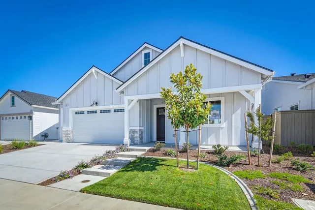 a front view of the house with a yard