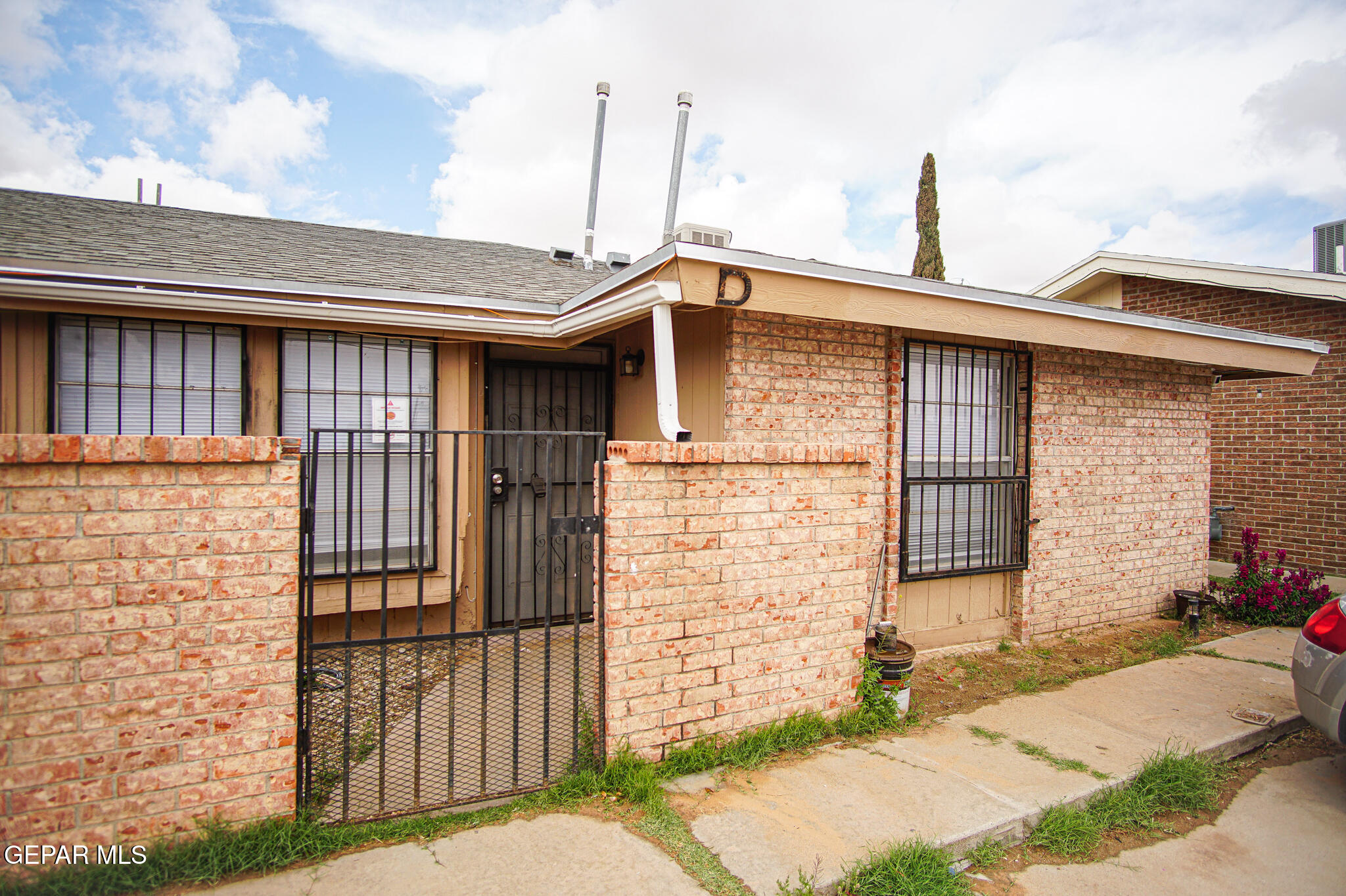 a front view of a house with parking