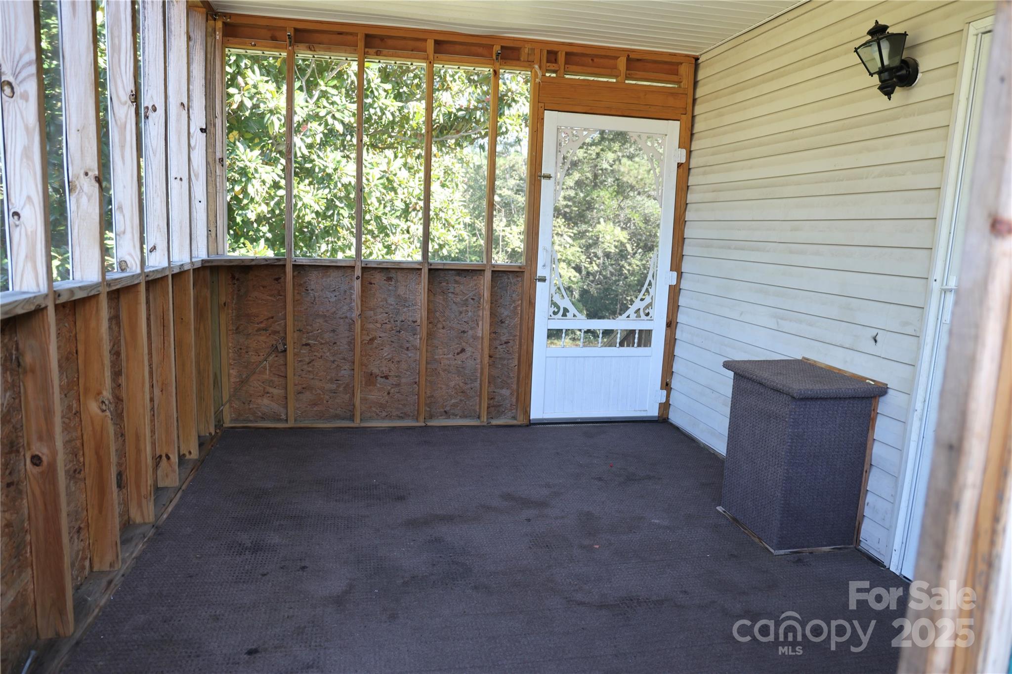 294 Mizpah Road Rockingham, NC 28379 - Photo 12 of 12 a view of an empty room with a fireplace and a window
