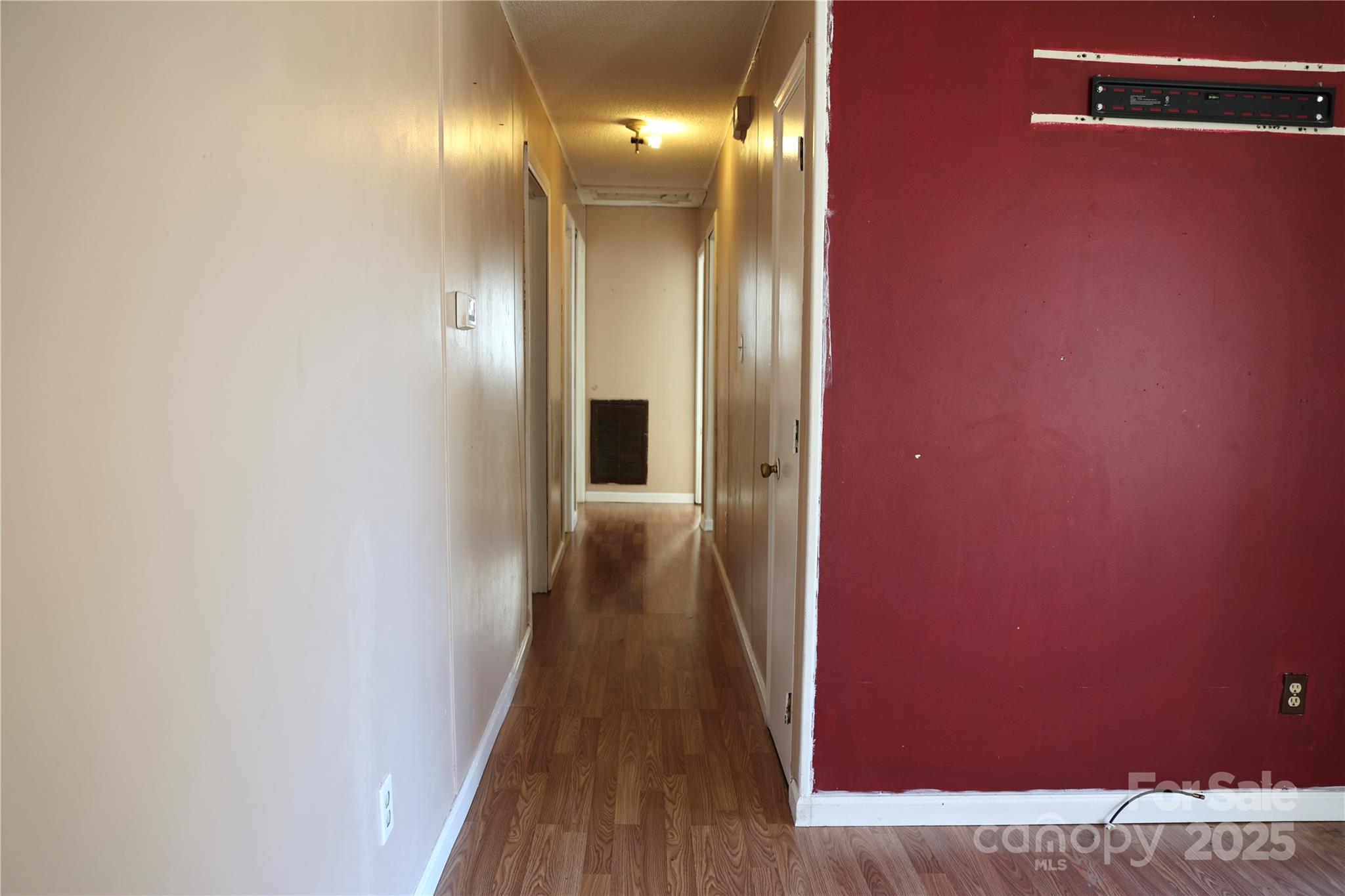 294 Mizpah Road Rockingham, NC 28379 - Photo 6 of 12 a view of a hallway with wooden floor