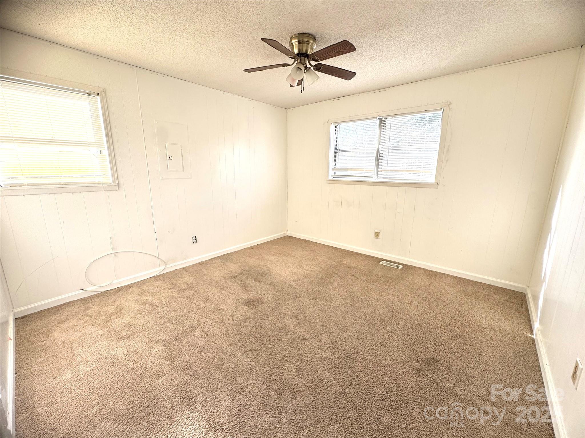 294 Mizpah Road Rockingham, NC 28379 - Photo 7 of 12 an empty room with a window and a ceiling fan