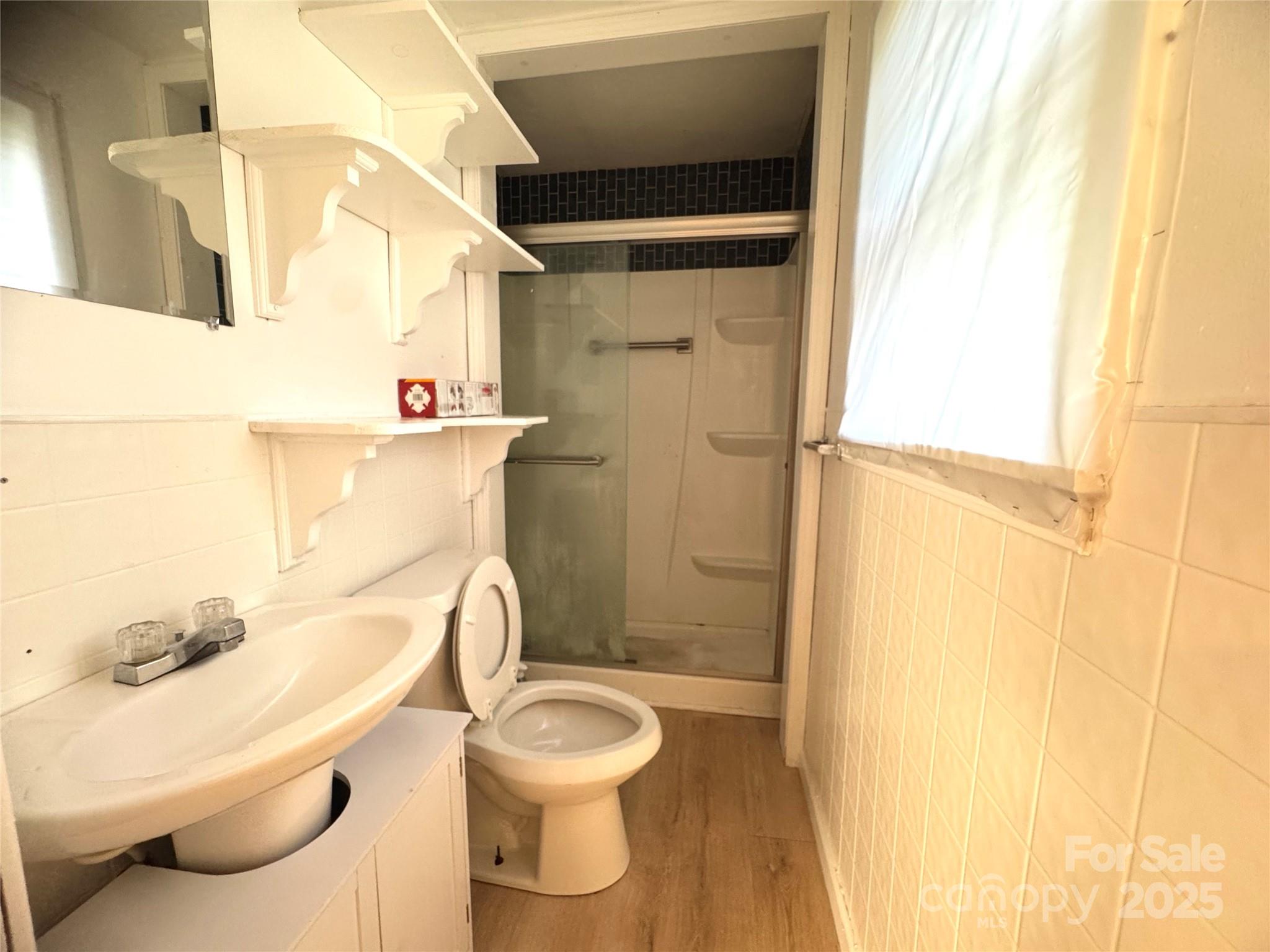 294 Mizpah Road Rockingham, NC 28379 - Photo 8 of 12 a bathroom with a toilet and a shower