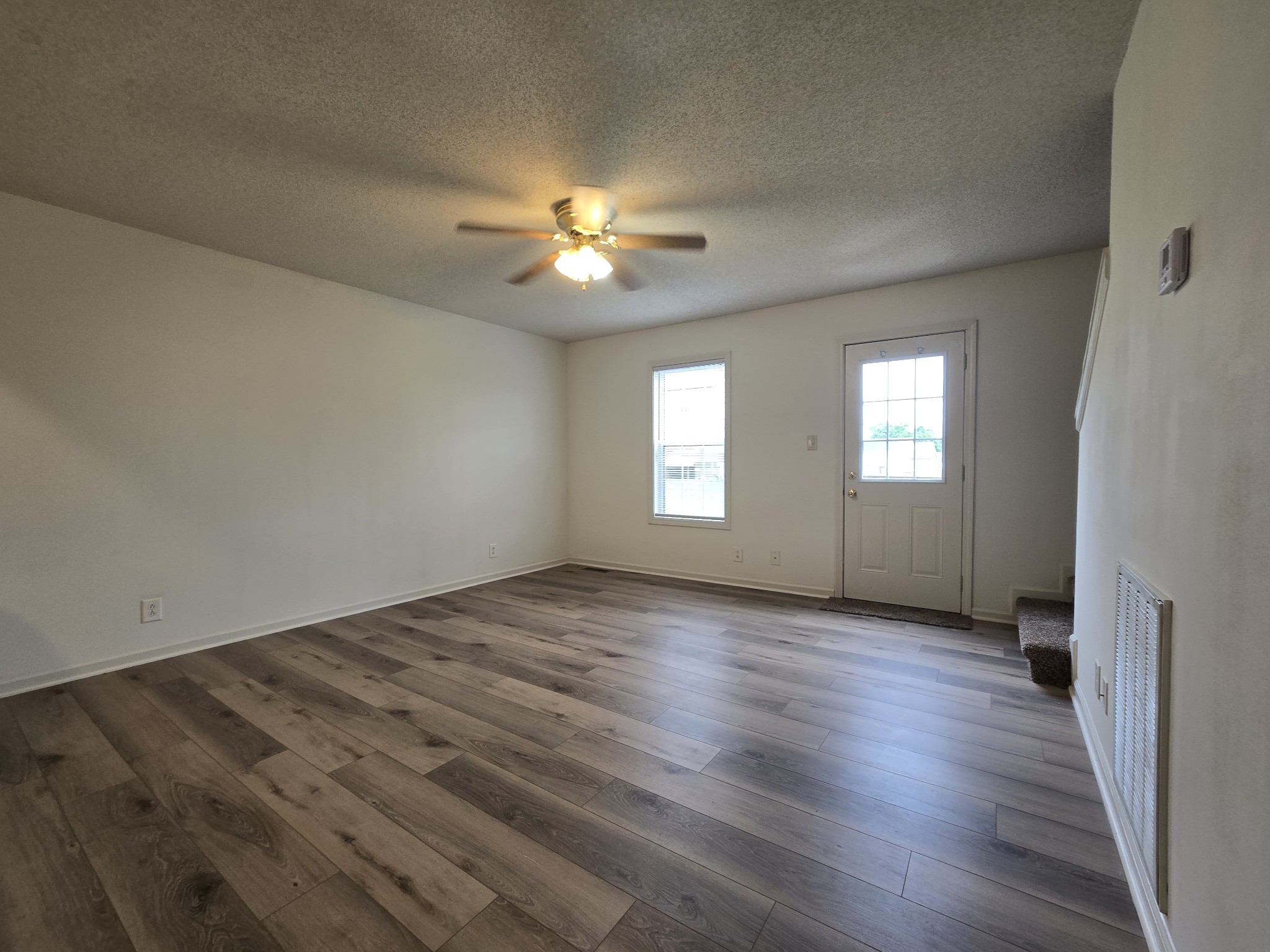 237 State Line Road Oak Grove, KY 42262 - Photo 9 of 20 wooden floor in an empty room with a window