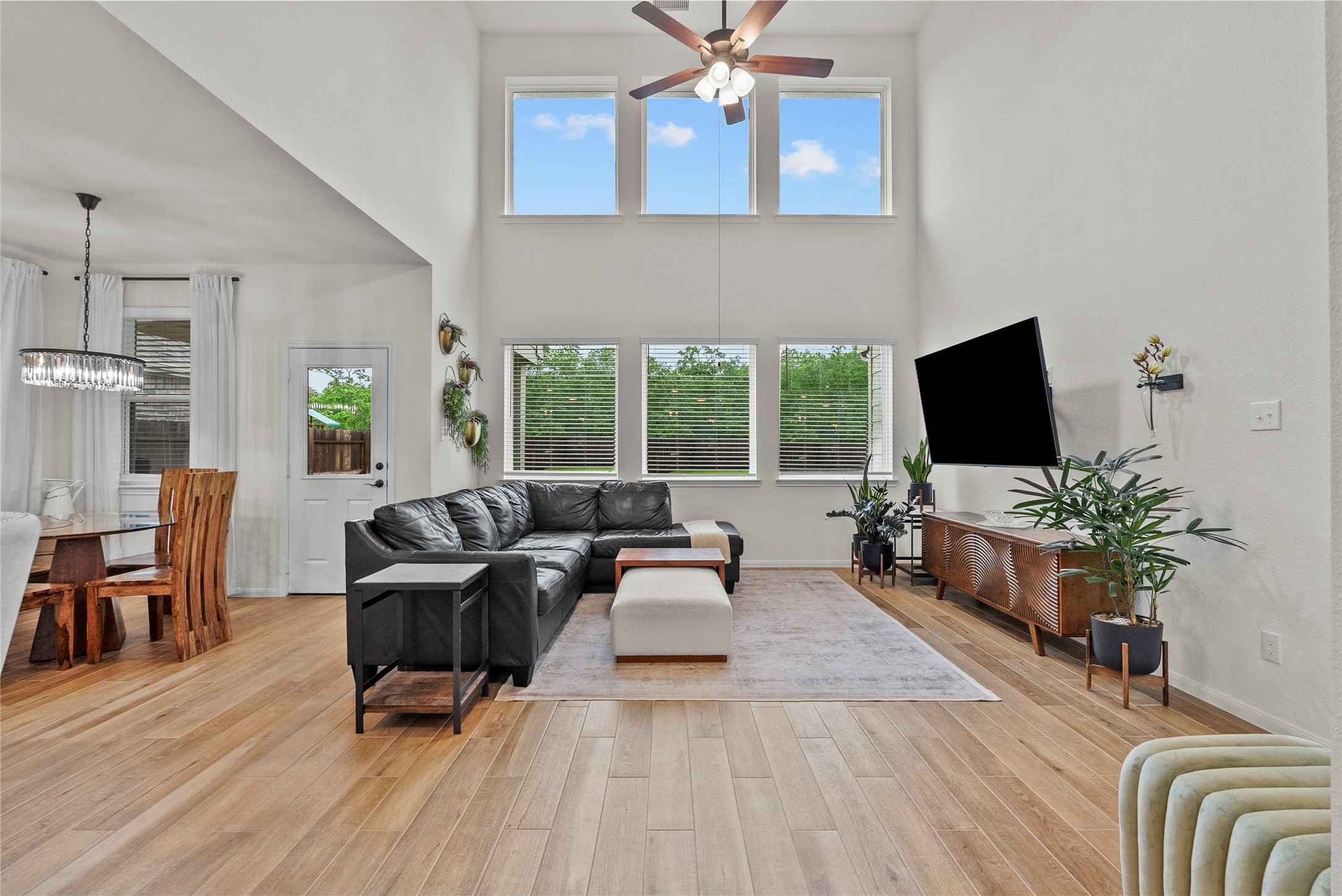 2727 Bisbee Road League City, TX 77573 - Photo 13 of 47 Soaring ceilings with floor to ceiling windows make this home bright and airy