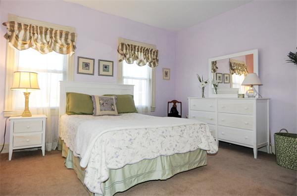 54 Boston Road, Unit A1 Chelmsford, MA 01824 - Photo 14 of 15 a bedroom with a bed and a cabinets