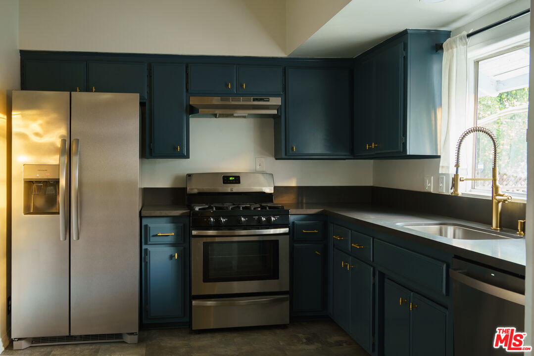 3210 Manitou Avenue Los Angeles, CA 90031 - Photo 11 of 26 a kitchen with a stove and a refrigerator