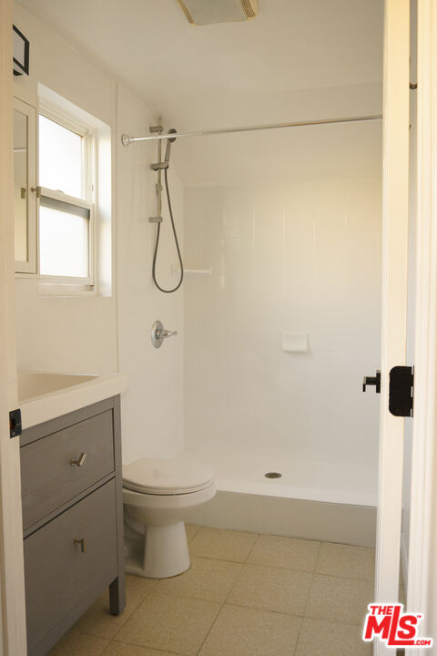 3210 Manitou Avenue Los Angeles, CA 90031 - Photo 15 of 26 a bathroom with a granite countertop sink a toilet and shower