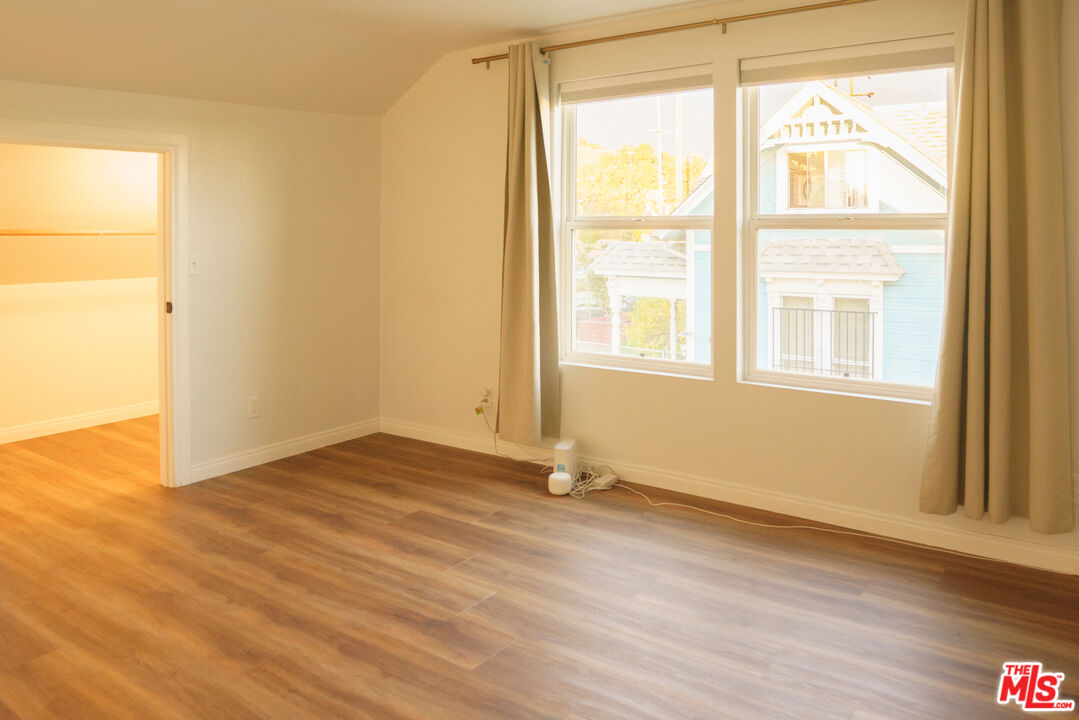 3210 Manitou Avenue Los Angeles, CA 90031 - Photo 19 of 26 an empty room with wooden floor and windows