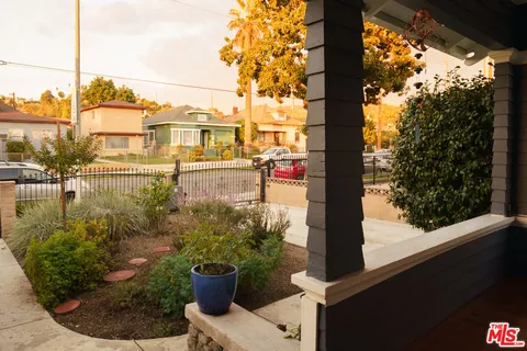 a view of a garden from a balcony