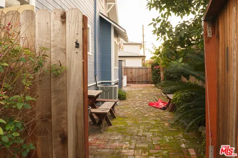 a backyard of a house with outdoor seating