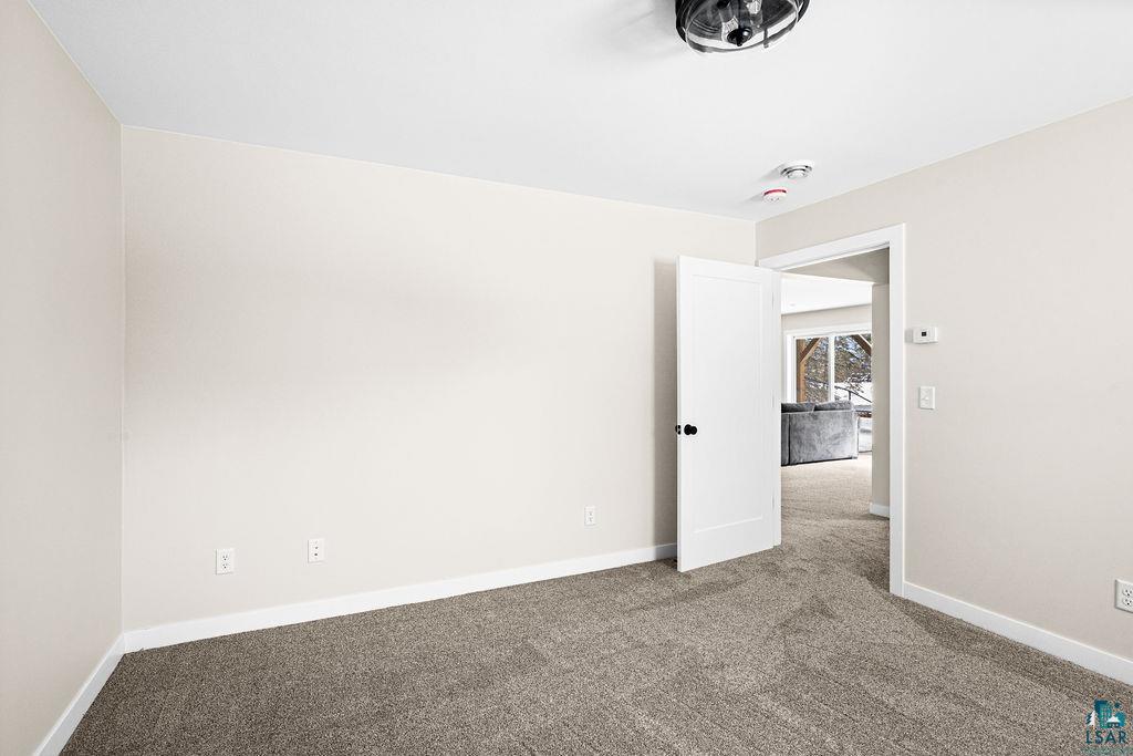2236 Hoover Street Duluth, MN 55811 - Photo 31 of 52 Carpeted spare room with baseboards