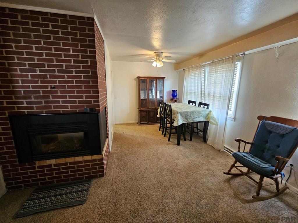 900 Rittgers Street Eads, CO 81036 - Photo 6 of 31 a view of livingroom with furniture and a fireplace
