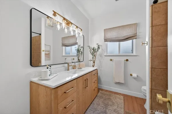 an aerial view of a house with garden space and street view