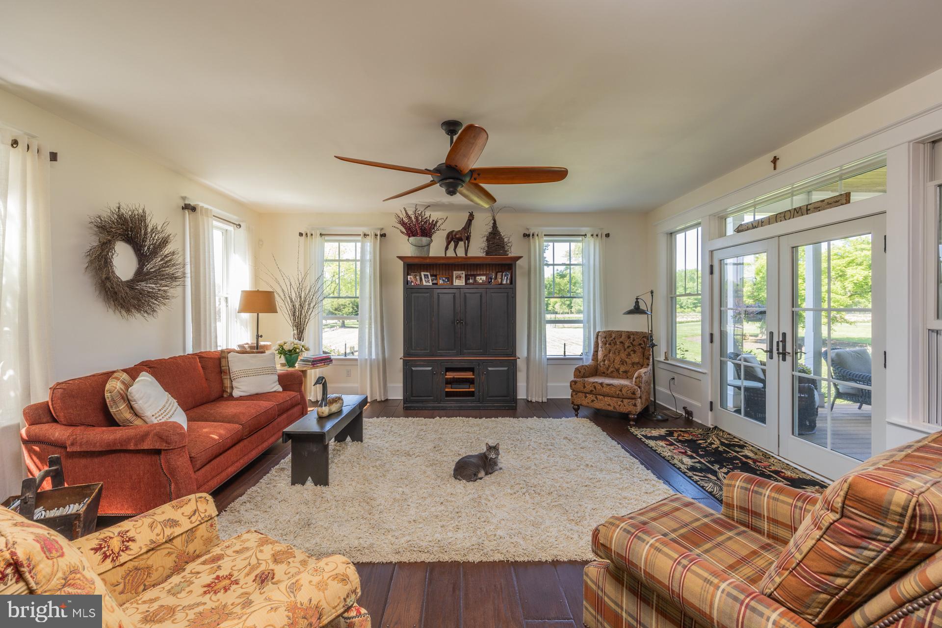 550 Hands Mill Road Woodbine, NJ 08270 - Photo 33 of 57 a living room with furniture a fireplace and a chandelier