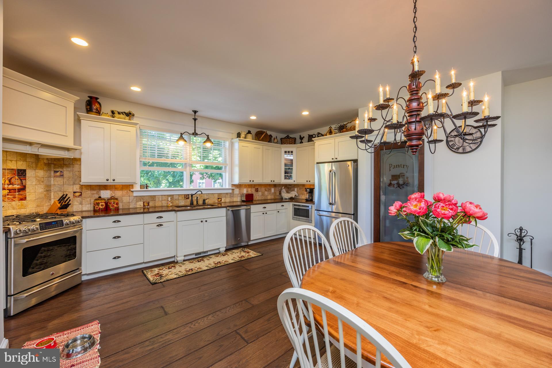 550 Hands Mill Road Woodbine, NJ 08270 - Photo 35 of 57 a kitchen with stainless steel appliances kitchen island granite countertop a dining table chairs and granite counter tops