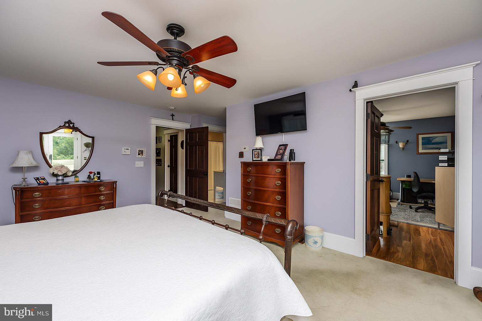 550 Hands Mill Road Woodbine, NJ 08270 - Photo 41 of 57 a bedroom with a bed and a chandelier