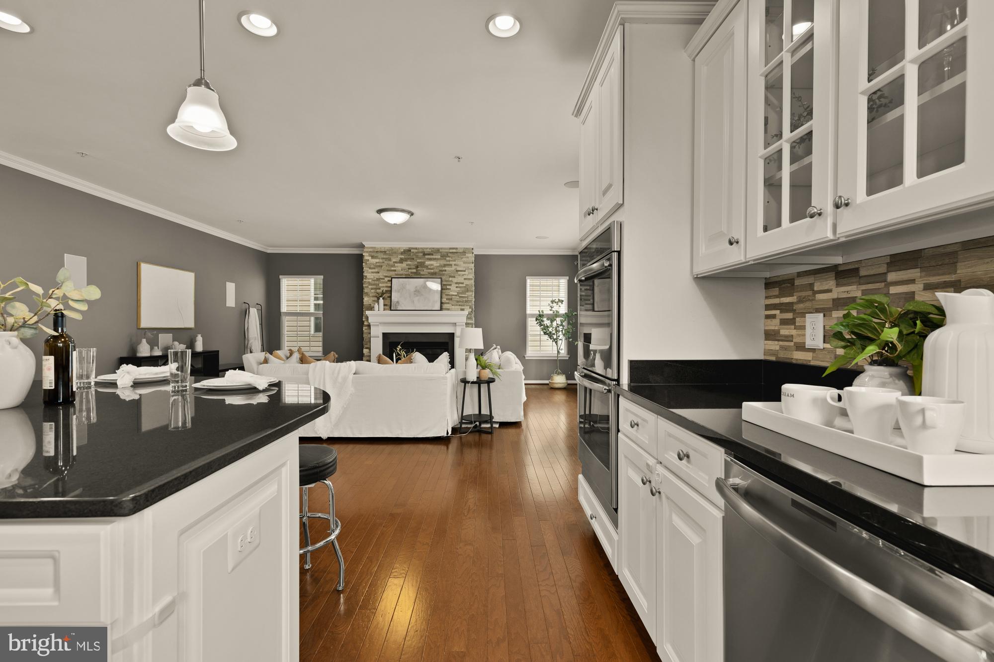15611 Coolidge Avenue Silver Spring, MD 20906 - Photo 14 of 57 a kitchen with stainless steel appliances granite countertop a lot of counter space and wooden floors