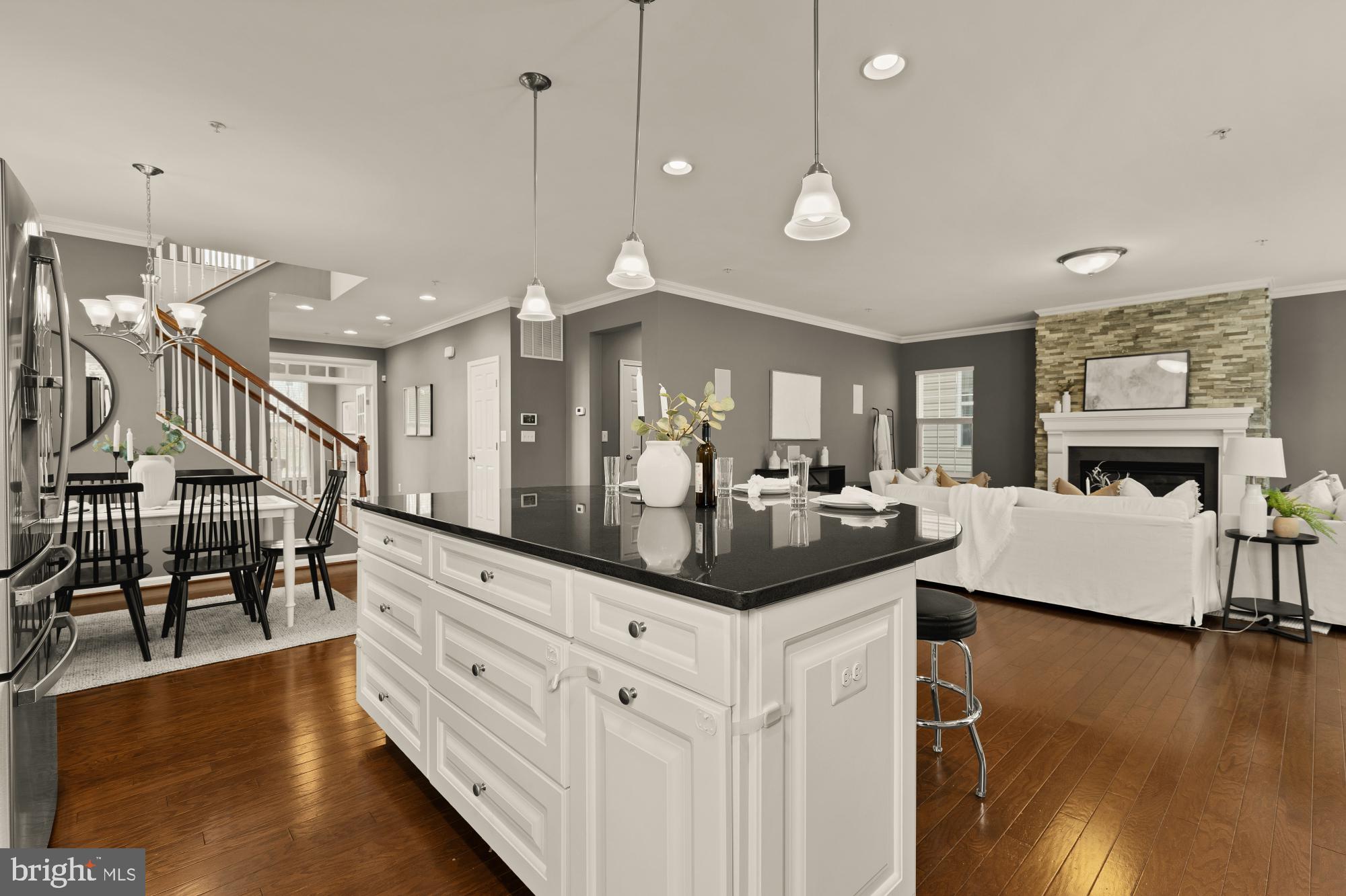 15611 Coolidge Avenue Silver Spring, MD 20906 - Photo 15 of 57 a kitchen with granite countertop a stove a sink a dining table and chairs with wooden floor