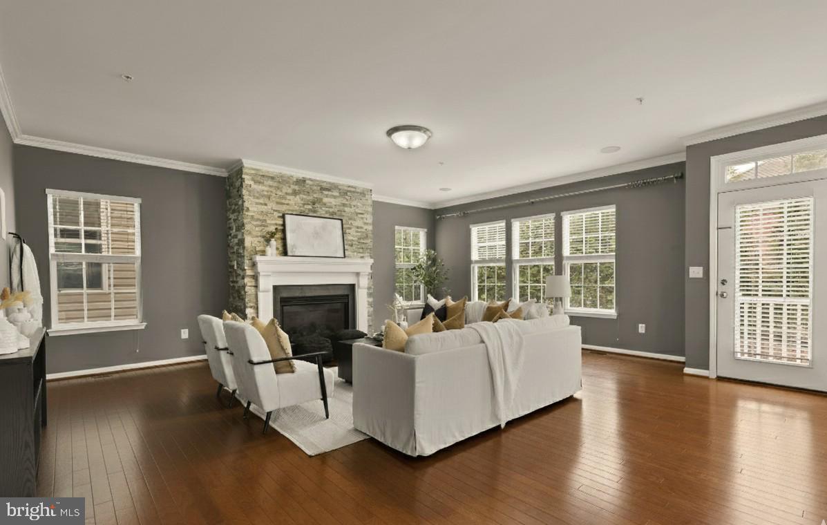 15611 Coolidge Avenue Silver Spring, MD 20906 - Photo 22 of 57 a living room with furniture a fireplace and wooden floor