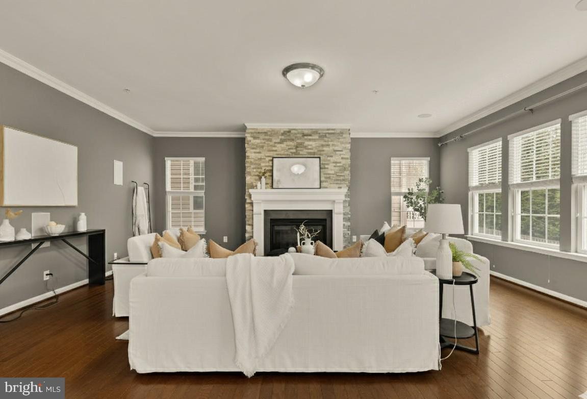 15611 Coolidge Avenue Silver Spring, MD 20906 - Photo 23 of 57 a living room with furniture a large window and a fireplace