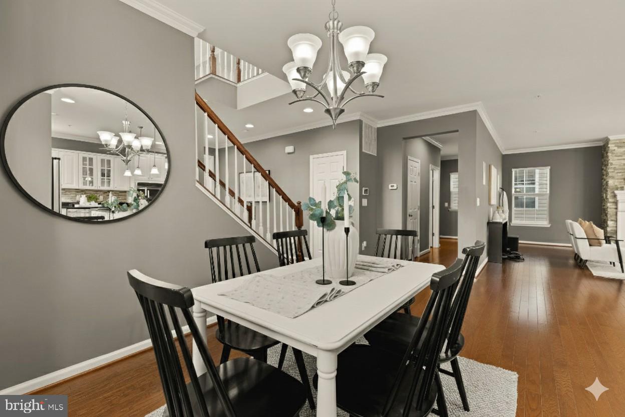 15611 Coolidge Avenue Silver Spring, MD 20906 - Photo 24 of 57 a view of a dining room with furniture and a chandelier