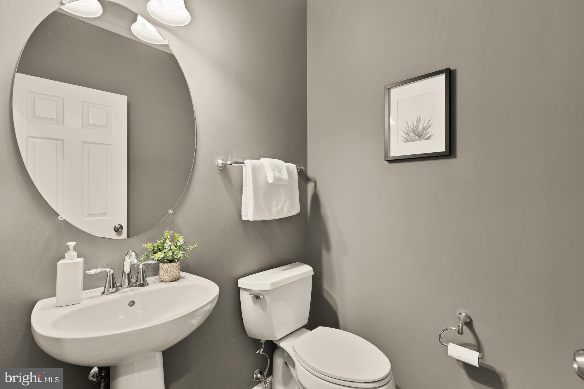 15611 Coolidge Avenue Silver Spring, MD 20906 - Photo 26 of 57 a bathroom with a toilet sink and mirror