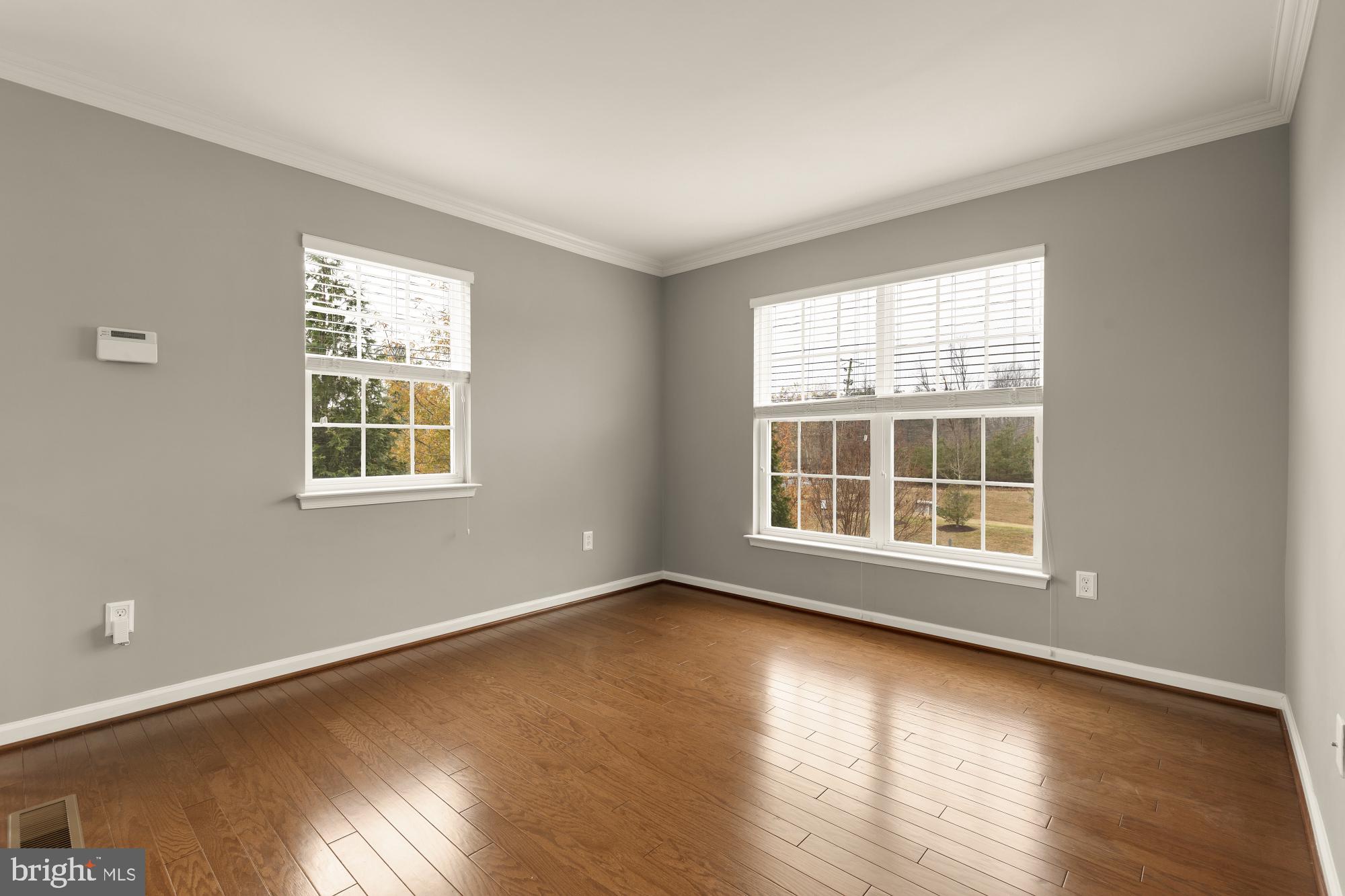 15611 Coolidge Avenue Silver Spring, MD 20906 - Photo 27 of 57 a view of an empty room with wooden floor and a window