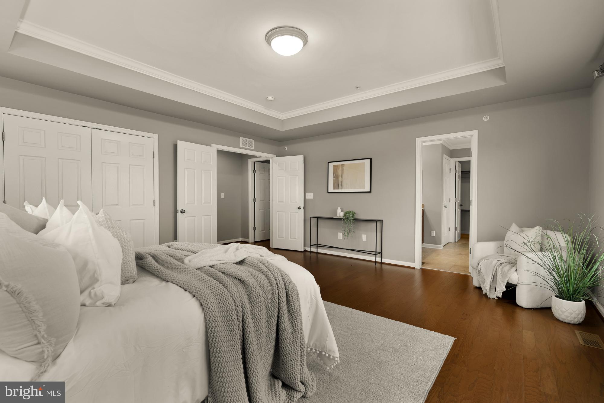 15611 Coolidge Avenue Silver Spring, MD 20906 - Photo 31 of 57 a spacious bedroom with a bed and entryway